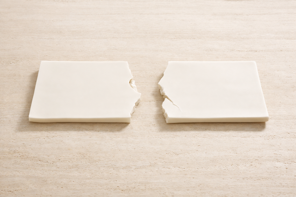 photo_2_minimalist_broken_limoges_porcelain_slab_on_travertine_surface_intentional_gap_edited_form_quiet_luxury_material_study