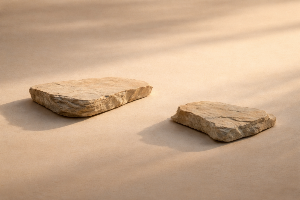 photo_4_mediterranean_sandstone_editorial_still_life_two_irregular_stone_slabs_asymmetrical_balance_warm_golden_hour_light_quiet_luxury_landscape