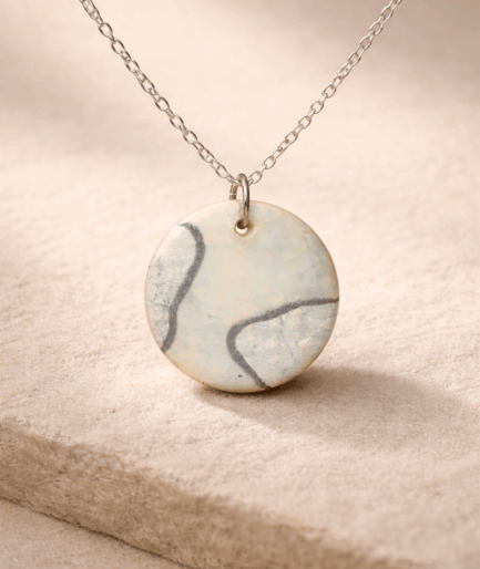 noira_rustic_grace_ivory_round_clay_pendant