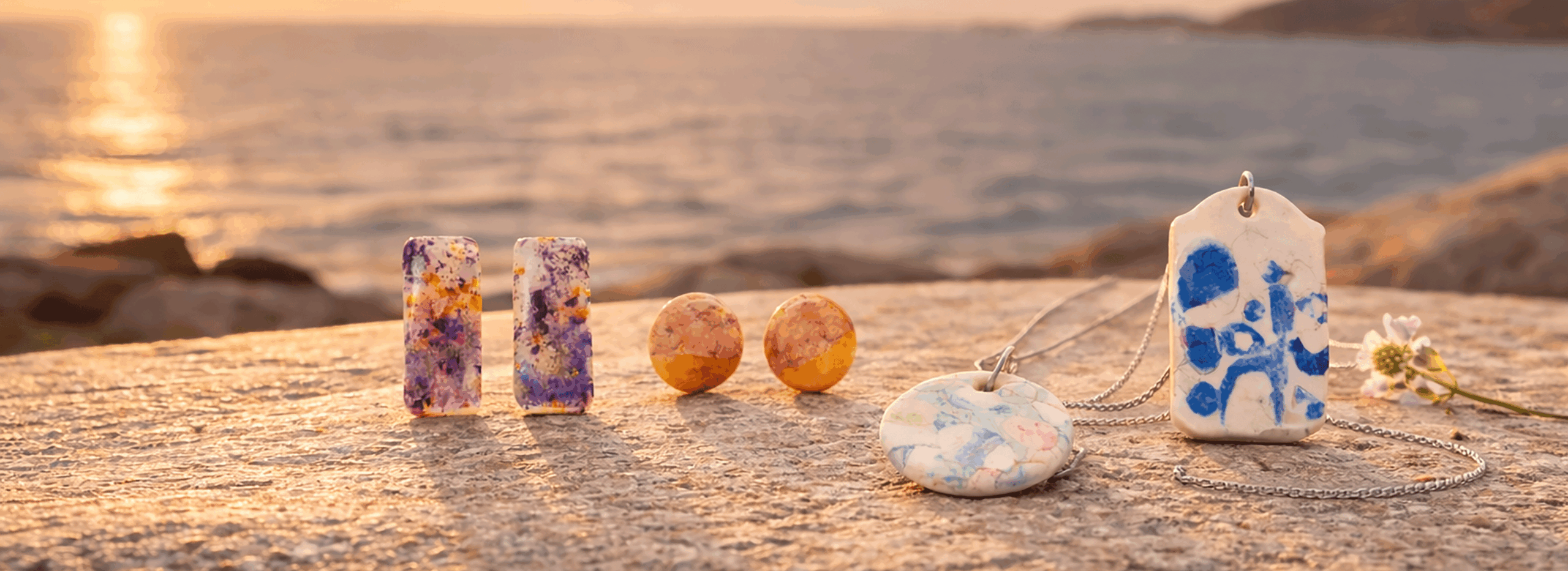 handmade_ceramic_jewelry_collection_on_galician_granite_with_atlantic_ocean_background_sunset_lifestyle_campaign_photo_suzy_decor