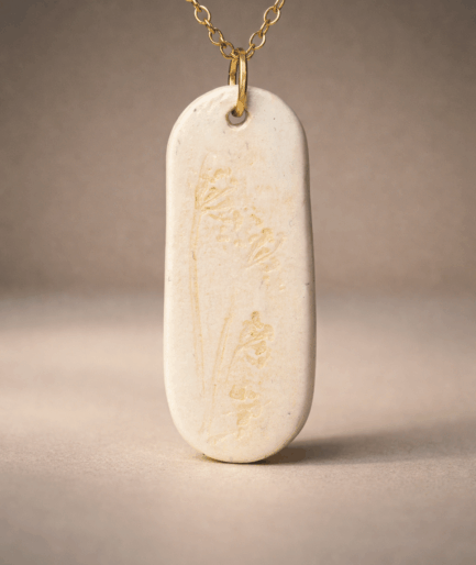 solenne_pure_form_white_gold_floral_long_clay_necklace
