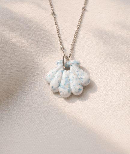 handmade_ceramic_shell_pendant_white_blue_speckled_glossy_camino_inspired_necklace