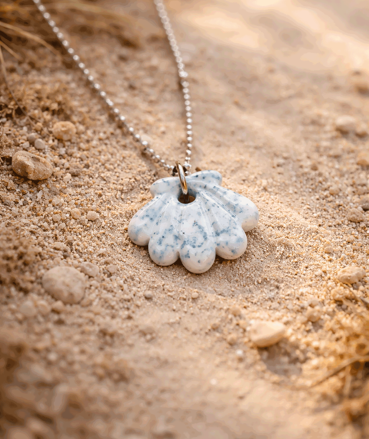 handmade_ceramic_shell_pendant_white_blue_speckled_glossy_camino_inspired_necklace